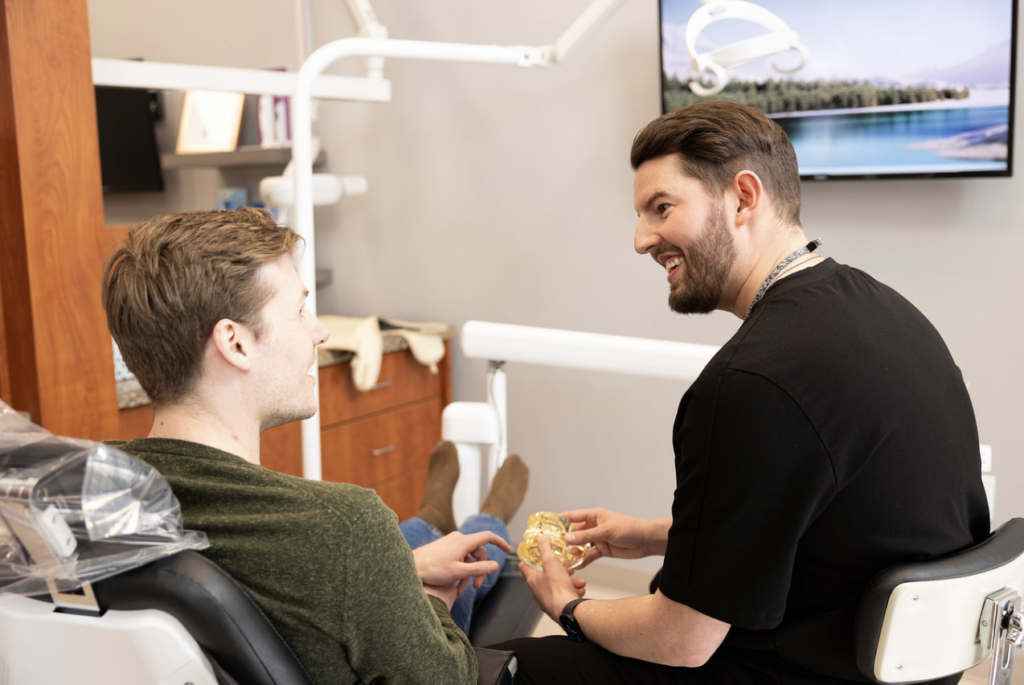 Dr. Nick Moen helping a patient with his dental care